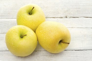 three golden delicious apples