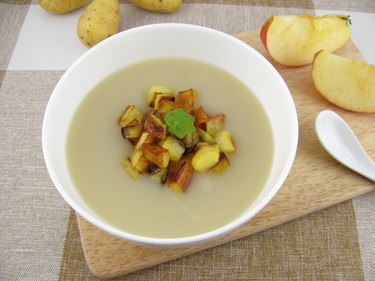 Potato soup with roasted apple pieces
