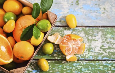 Fresh citrus fruits in the wooden box