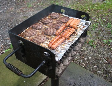 Meat cooking on charcoal grill