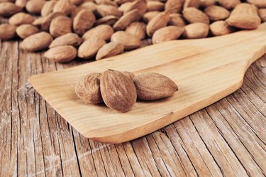 shelled almonds on a wooden table