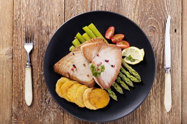 Grilled tuna steak served on asparagus with roasted zmieniakami