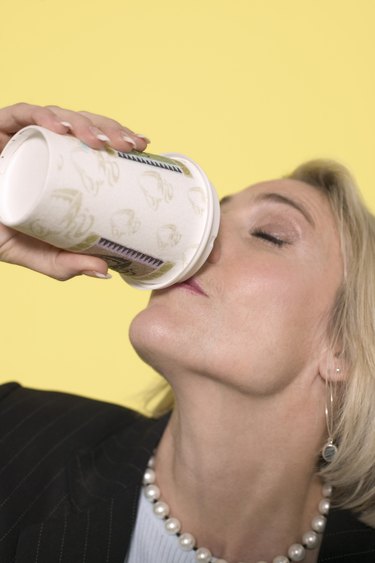 Woman drinking from beverage cup