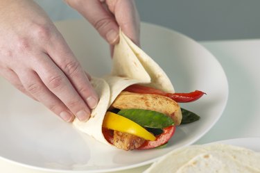 Wrapping tortilla around filling, close up