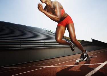 Woman running speed race action Cut Out Stock Images & Pictures