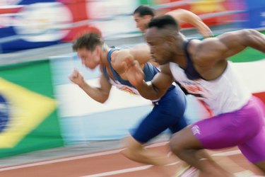 Three men running at a race