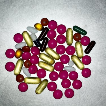 Assorted coloured pills, close up