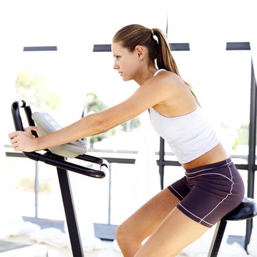 young woman working out on an exercise machine