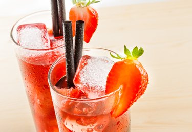 detail of two glasses of strawberry cocktail with ice