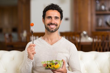 Man eating a salad