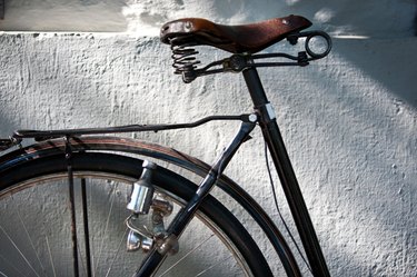 Detail of a Vintage Bicycle Seat, Wheel, Dynamo and Lock