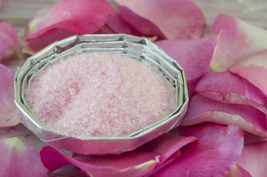 Pink aromatic bath in a bowl salt decorated with roses
