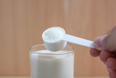 Collagen protein powder in a measuring spoon.