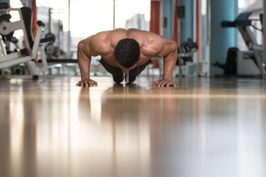 Young Adult Athlete Doing Push Ups As Part Of Bodybuilding Training