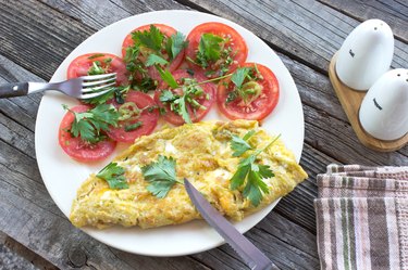 Omelette fried eggs with vegetables