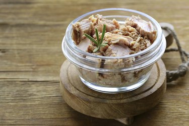 canned tuna with rosemary in a glass jar