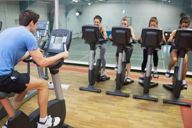 Male instructor teaches Spinning Class
