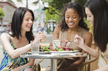 Women eating at outdoor cafe