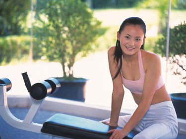 Image of a Young Adult Woman About to do Some Exercises, Looking at Camera, Smiling, Differential Focus