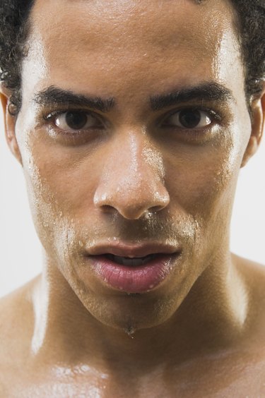 Close up of Mixed Race man's wet face