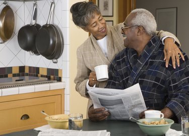 Senior African couple at breakfast table