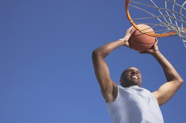 African man shooting basketball