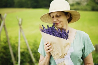 Woman smelling bouquet of flowers