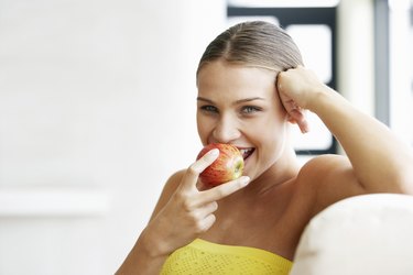 Young Woman Eating an Apple