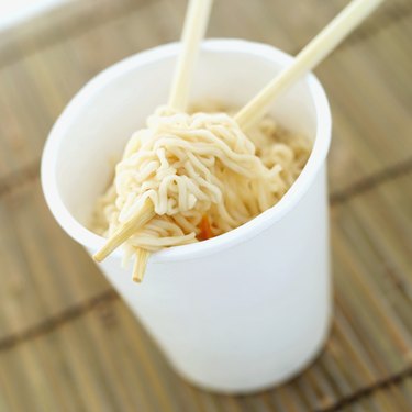high angle view of chinese noodles in a bowl with a pair of chopsticks