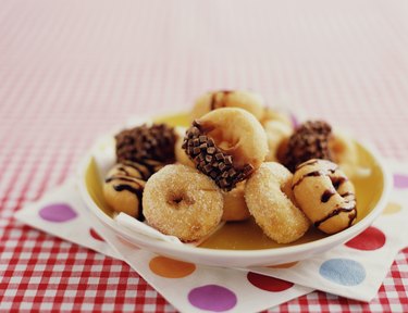 Assortment of doughnuts on plate, close-up