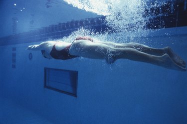 Woman swimming in pool, underwater view