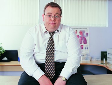 Portrait of an Overweight Businessman in a Doctor's Office