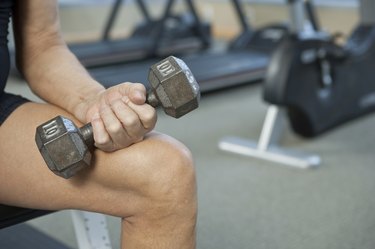 Man holding dumbbell