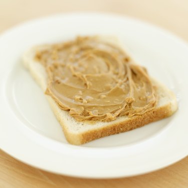 Close-up of peanut butter on a slice of bread