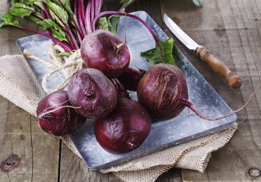 Organic beetroot over rustic wooden background