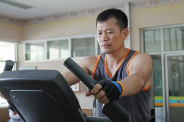 Exercising in the gym,Man walking on treadmill.