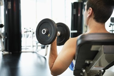 Man Weightlifting in Health Club