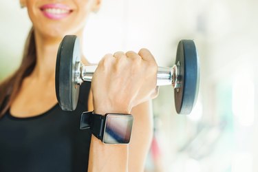 Smart watch on women hand in gym