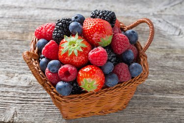 basket with fresh seasonal berries, top view