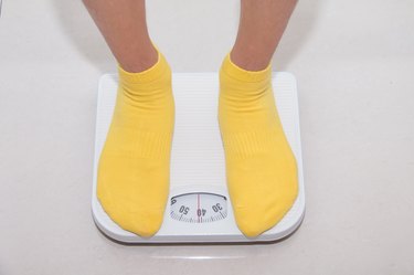 Closeup of a Asians weighed