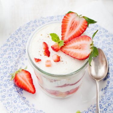 Strawberry tiramisu, trifle, custard dessert with mint leaves