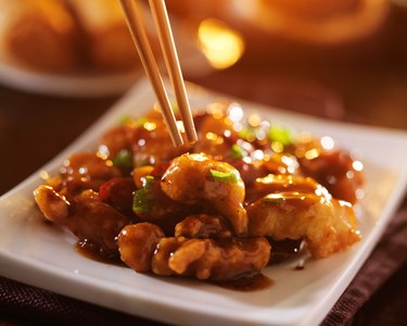 eating chinese food general tso's chicken