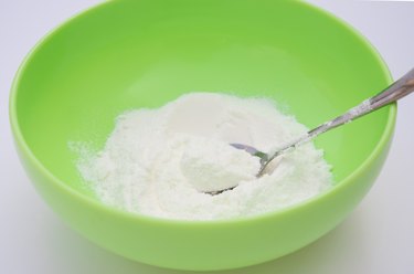 preparing powdered milk in a bowl