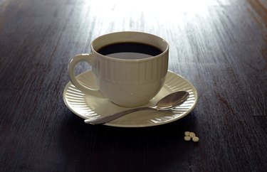 Coffee, white mug, saucer, teaspoon, sugar on table 1