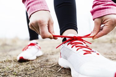 Runner tying sport shoes
