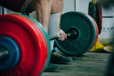 man of powerlifter athlete squat deadlift