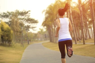 healthy lifetyle asian woman jogging at tropical park