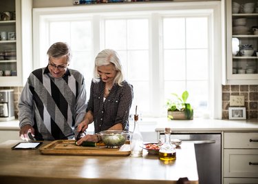 Senior couple preparing dinner