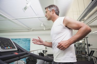 Fit man working out on treadmill