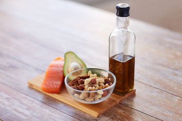 close up of food and olive oil bottle on table